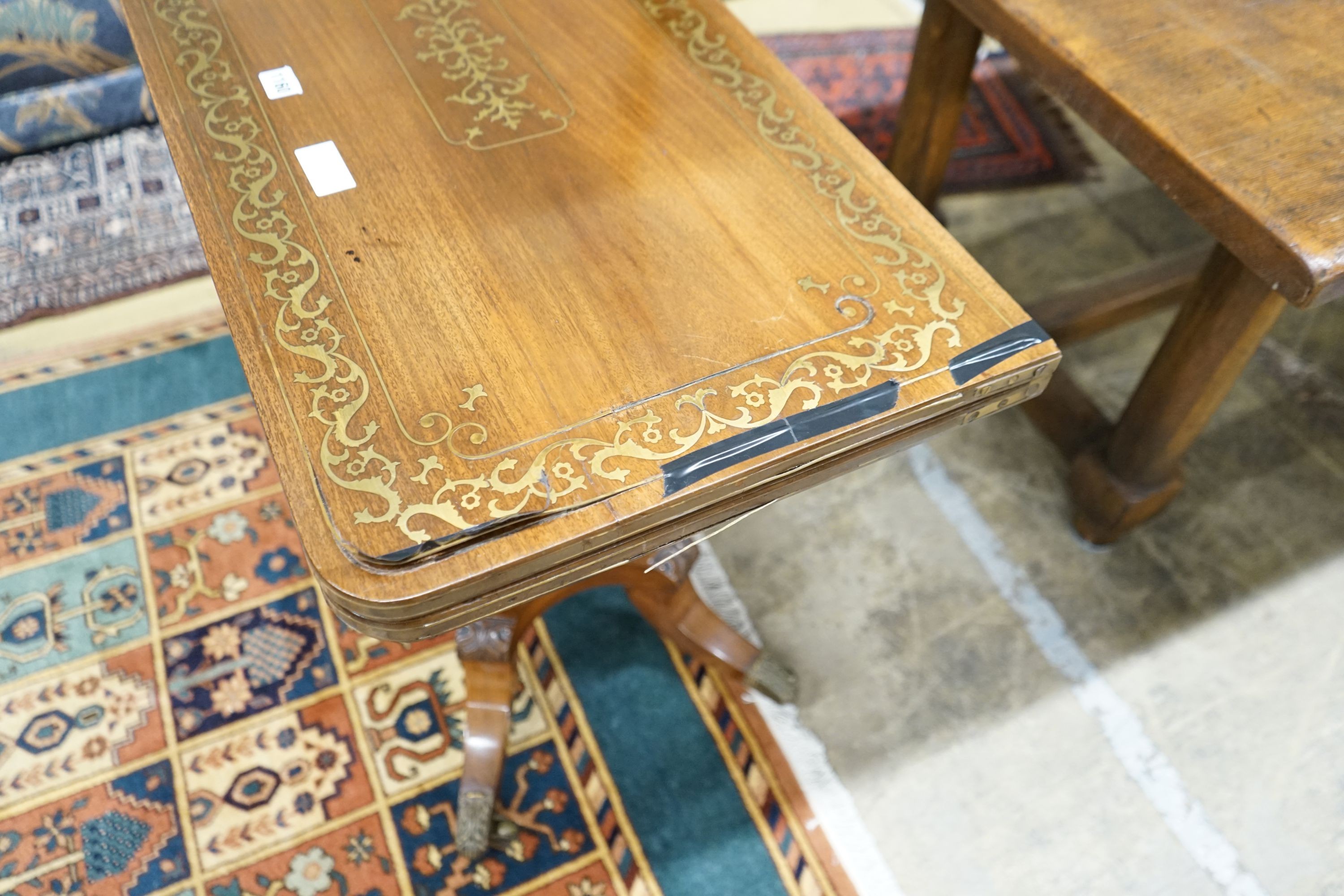 A Regency brass inlaid mahogany rectangular folding card table, width 86cm, depth 43cm, height 74cm